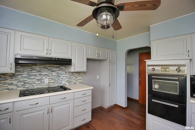 1524 W 4th St, Milan, IL 61264 - kitchen with under cabinet range hood, black appliances, arched walkways, ceiling fan, and tasteful backsplash
