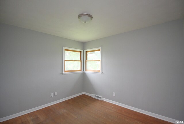 1524 W 4th St, Milan, IL 61264 - empty room with baseboards and wood finished floors