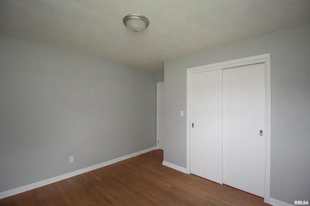 1524 W 4th St, Milan, IL 61264 - unfurnished bedroom with wood finished floors and a closet