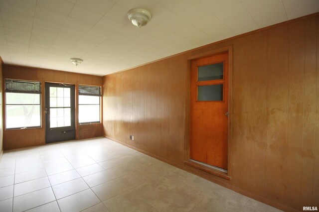 1524 W 4th St, Milan, IL 61264 - unfurnished room featuring wood walls and baseboards