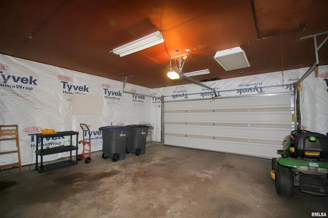 1524 W 4th St, Milan, IL 61264 - garage featuring a garage door opener