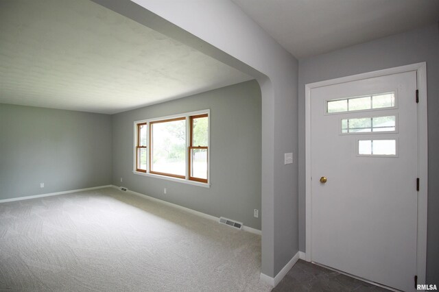 1524 W 4th St, Milan, IL 61264 - entrance foyer featuring baseboards and dark colored carpet