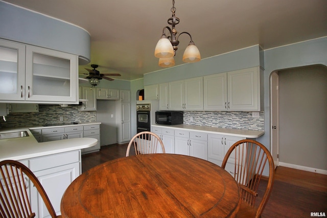 1524 W 4th St, Milan, IL 61264 - kitchen with black appliances, tasteful backsplash, dark wood finished floors, a ceiling fan, and light countertops
