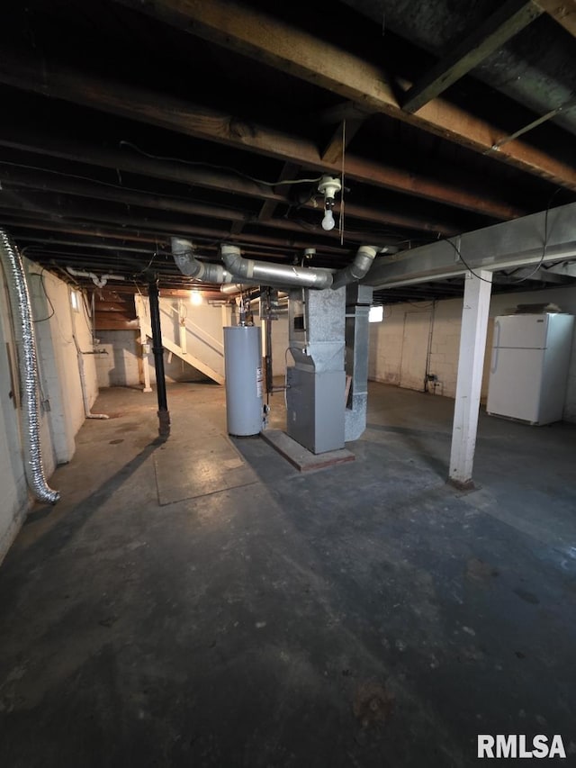 1405 26th St, Rock Island, IL 61201 - unfinished below grade area with freestanding refrigerator, water heater, and heating unit