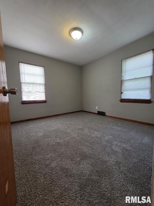 1405 26th St, Rock Island, IL 61201 - empty room with carpet floors and baseboards