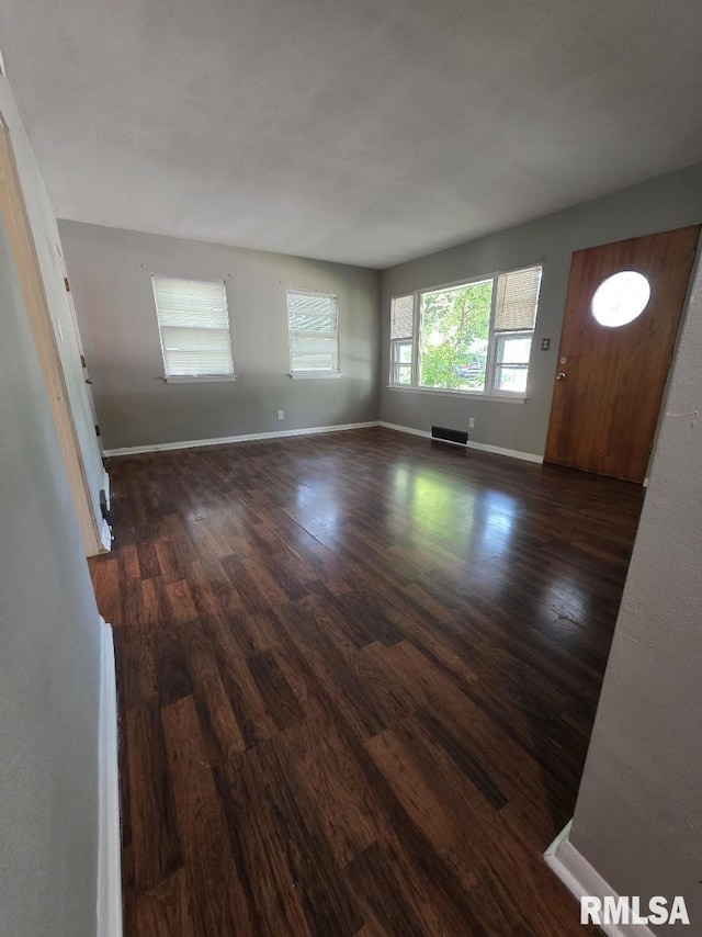 1405 26th St, Rock Island, IL 61201 - unfurnished living room with wood finished floors and baseboards