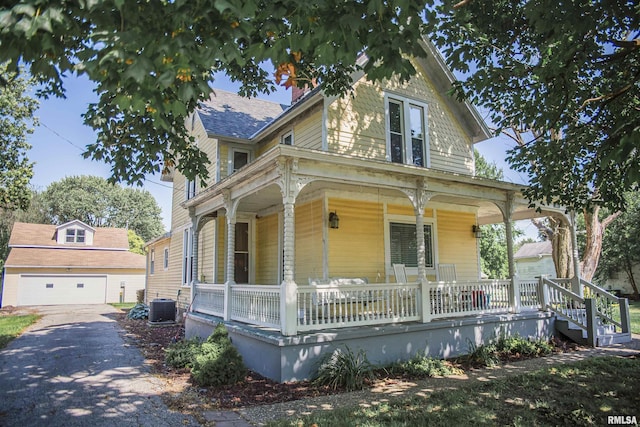 214 N Chestnut St, Mendon, IL 62351 - view of front of house with a porch, a garage, and an outdoor structure
