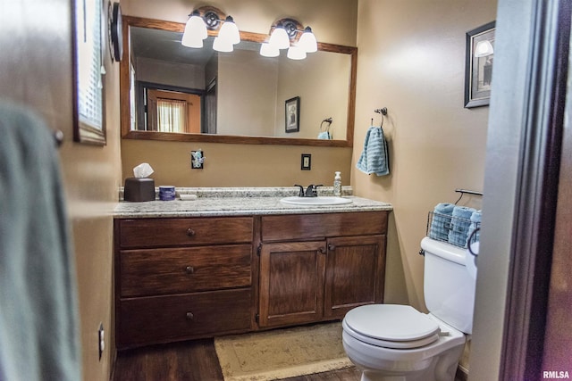 214 N Chestnut St, Mendon, IL 62351 - half bath featuring vanity and wood finished floors