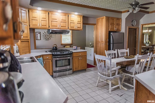 214 N Chestnut St, Mendon, IL 62351 - kitchen featuring stainless steel appliances, under cabinet range hood, ornamental molding, light countertops, and a ceiling fan