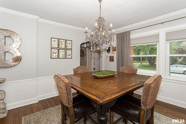 3205 Crestline Dr, Davenport, IA 52803 - dining room with dark wood-style flooring, a chandelier, and crown molding