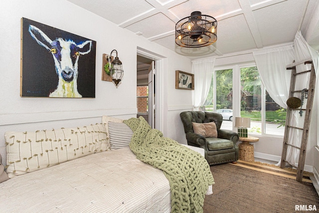 3205 Crestline Dr, Davenport, IA 52803 - bedroom featuring coffered ceiling and a chandelier