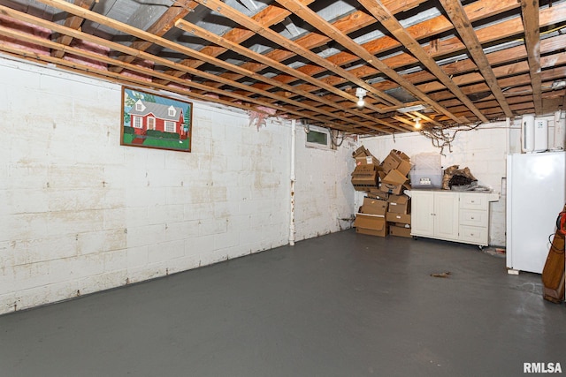 3205 Crestline Dr, Davenport, IA 52803 - unfinished below grade area featuring freestanding refrigerator
