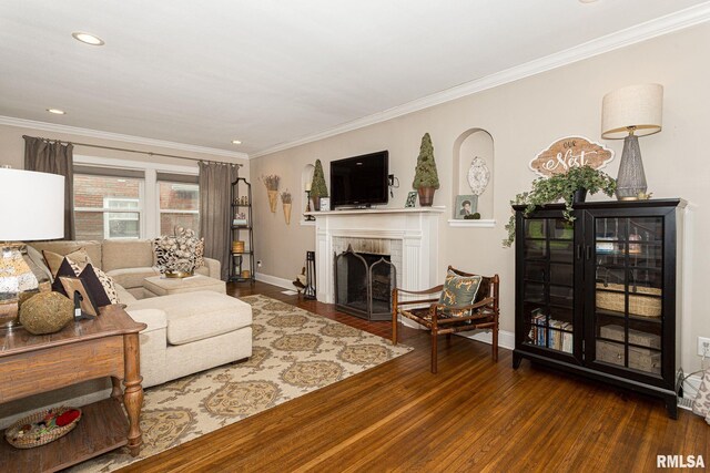 3205 Crestline Dr, Davenport, IA 52803 - living area featuring wood finished floors, crown molding, a fireplace with flush hearth, and recessed lighting