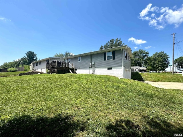202 S 10th Ave, New Windsor, IL 61465 - rear view of house featuring a deck and a yard