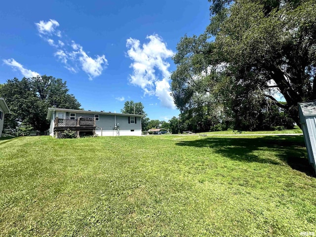 202 S 10th Ave, New Windsor, IL 61465 - view of green lawn with a deck