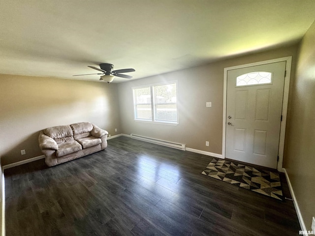 202 S 10th Ave, New Windsor, IL 61465 - foyer entrance featuring baseboard heating, dark wood finished floors, and a ceiling fan
