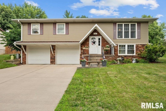833 Robin Rd, Muscatine, IA 52761 - view of front of house featuring brick siding, driveway, a front lawn, and a garage