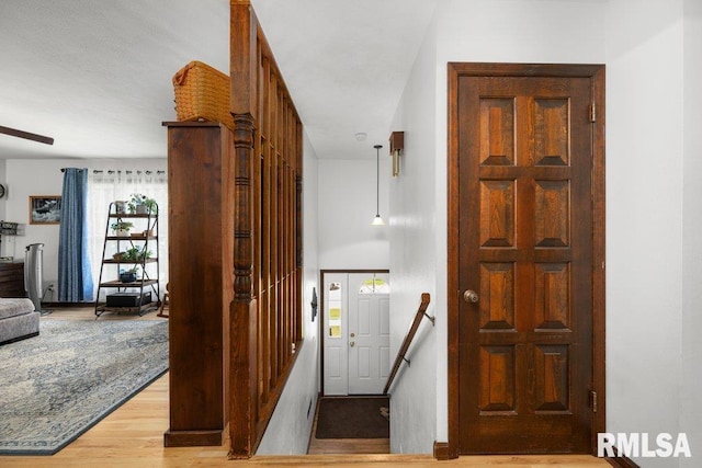 833 Robin Rd, Muscatine, IA 52761 - hallway featuring wood finished floors