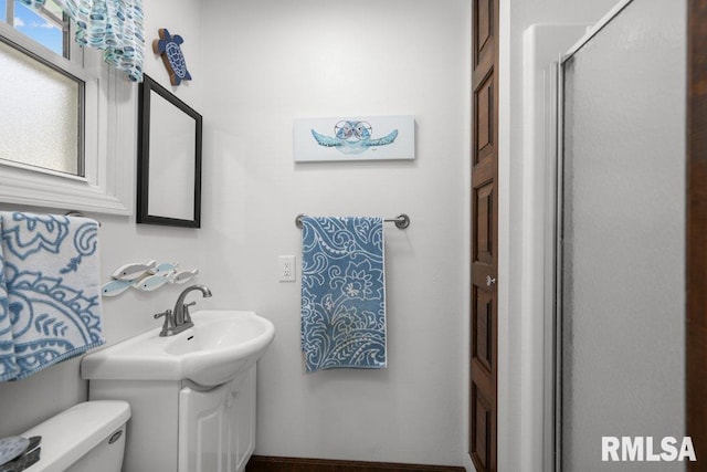 833 Robin Rd, Muscatine, IA 52761 - bathroom featuring vanity and a shower with shower door