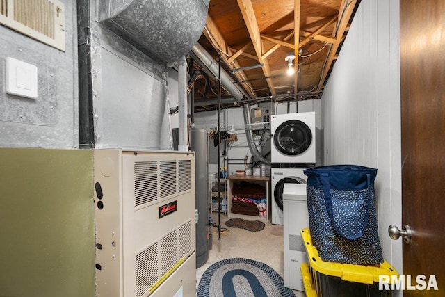 833 Robin Rd, Muscatine, IA 52761 - utilities with stacked washing machine and dryer, gas water heater, and heating unit