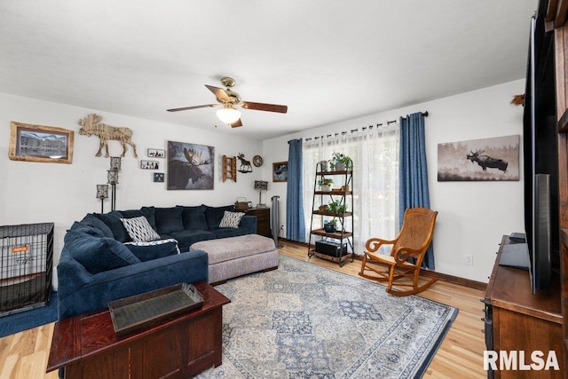 833 Robin Rd, Muscatine, IA 52761 - living room with ceiling fan and light wood finished floors