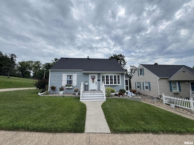 3125 Pershing Blvd, Clinton, IA 52732 - new england style home with a front yard and a shingled roof