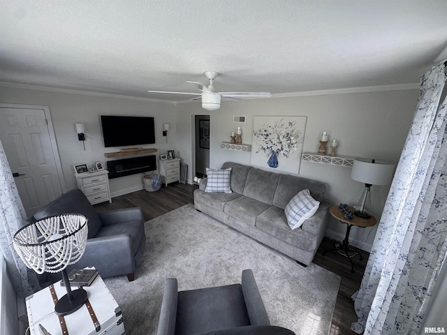 3125 Pershing Blvd, Clinton, IA 52732 - living room featuring wood finished floors, ceiling fan, and crown molding