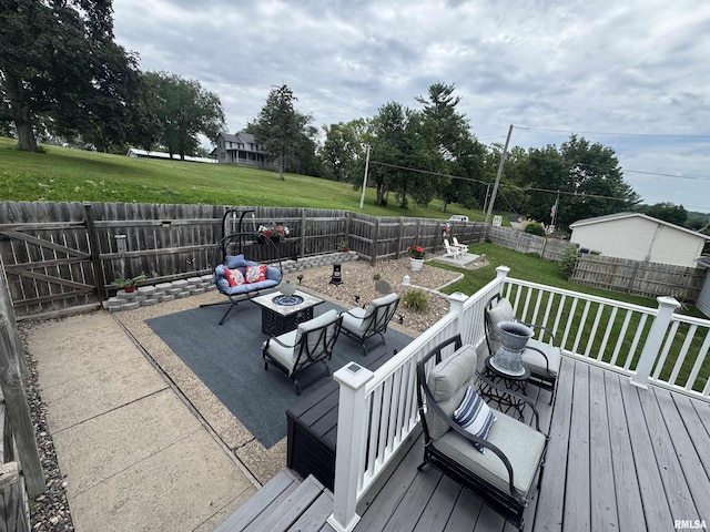 3125 Pershing Blvd, Clinton, IA 52732 - wooden deck featuring a patio area, a fenced backyard, and an outdoor living space with a fire pit