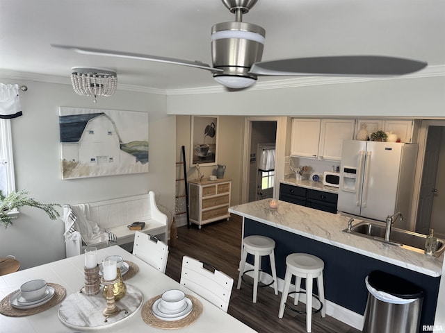 3125 Pershing Blvd, Clinton, IA 52732 - dining space featuring ornamental molding and dark wood-style floors