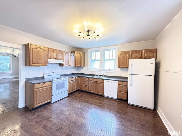 2111 Pine St, Murphysboro, IL 62966 - kitchen featuring white appliances, a chandelier, dark countertops, under cabinet range hood, and dark wood-style flooring