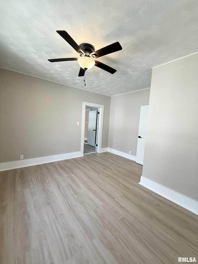 2111 Pine St, Murphysboro, IL 62966 - unfurnished room featuring ceiling fan, wood finished floors, and a textured ceiling
