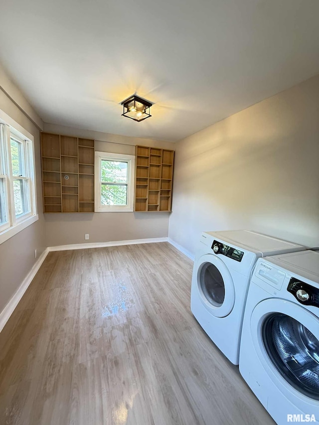 2111 Pine St, Murphysboro, IL 62966 - laundry area with separate washer and dryer, light wood-style flooring, and healthy amount of natural light