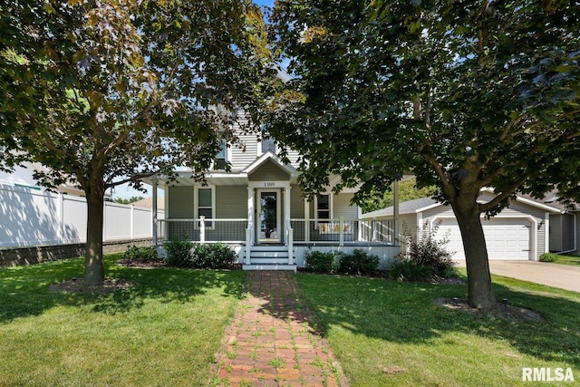 1309 5th St, Orion, IL 61273 - obstructed view of property featuring a porch, concrete driveway, and a garage