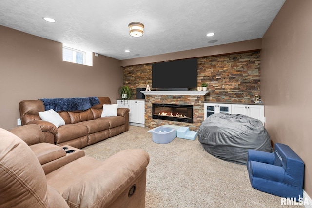 1309 5th St, Orion, IL 61273 - living area with carpet floors, a fireplace, recessed lighting, and a textured ceiling