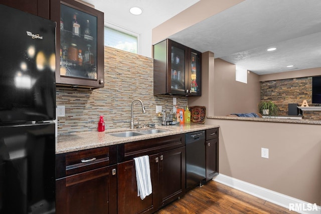 1309 5th St, Orion, IL 61273 - indoor wet bar with black appliances, tasteful backsplash, dark wood-type flooring, and recessed lighting