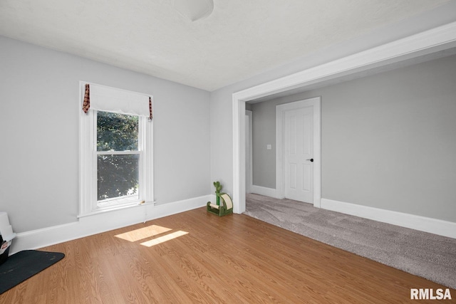 1309 5th St, Orion, IL 61273 - spare room featuring baseboards and wood finished floors