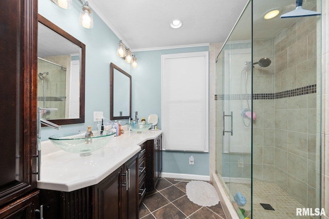 1309 5th St, Orion, IL 61273 - bathroom featuring double vanity, a shower stall, tile patterned flooring, crown molding, and recessed lighting