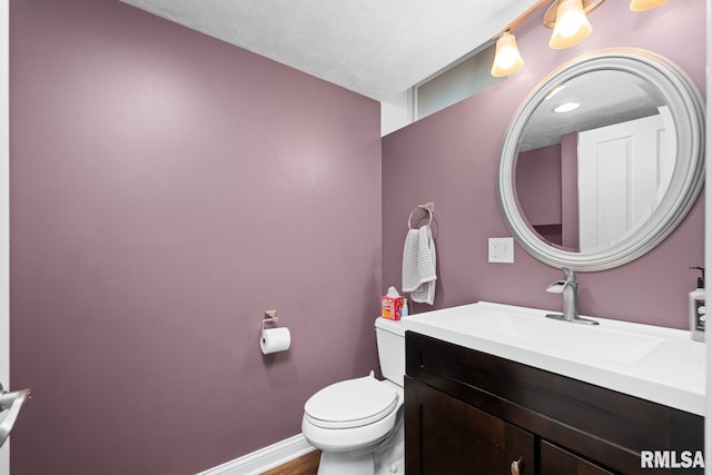 1309 5th St, Orion, IL 61273 - half bathroom featuring vanity and wood finished floors