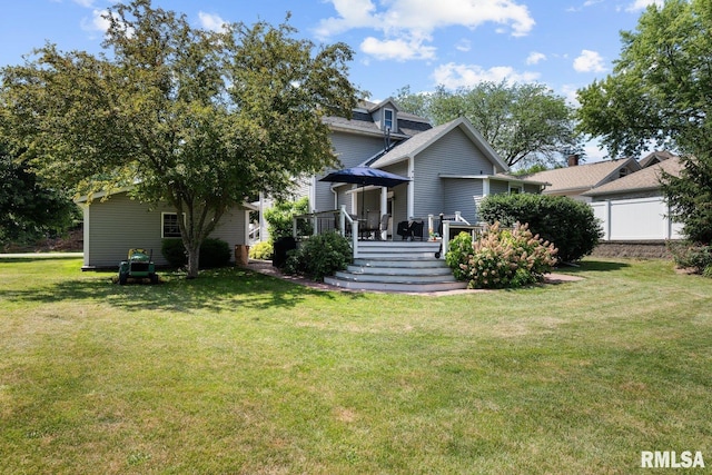 1309 5th St, Orion, IL 61273 - rear view of property featuring a deck and a lawn