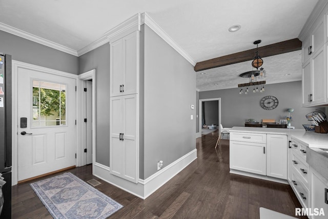1309 5th St, Orion, IL 61273 - kitchen with white cabinetry, a peninsula, light countertops, and ornamental molding