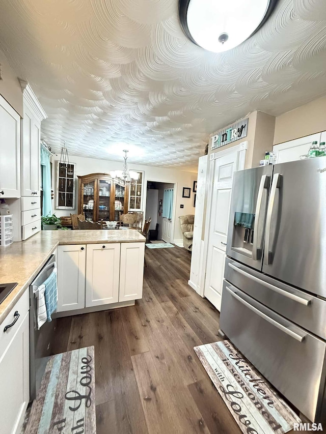 501 N Cambridge Dr, Desoto, IL 62924 - kitchen featuring stainless steel appliances, a chandelier, white cabinets, and a peninsula