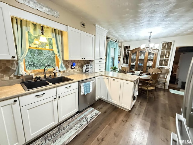 501 N Cambridge Dr, Desoto, IL 62924 - kitchen featuring dishwasher, a chandelier, white cabinets, and a peninsula