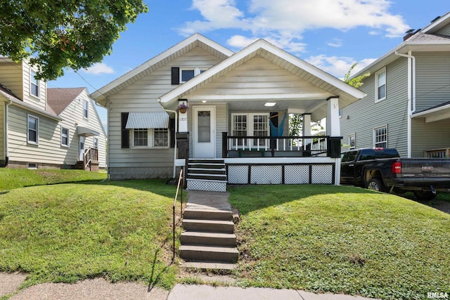 1207 N Marquette St, Davenport, IA 52804 - view of front of home featuring covered porch and a front yard