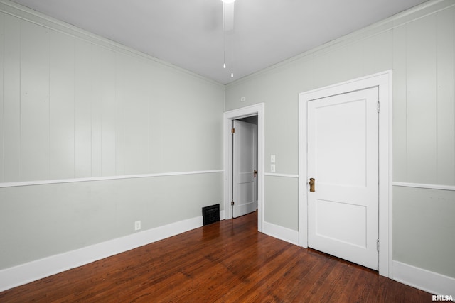 1207 N Marquette St, Davenport, IA 52804 - unfurnished bedroom with wood finished floors and crown molding