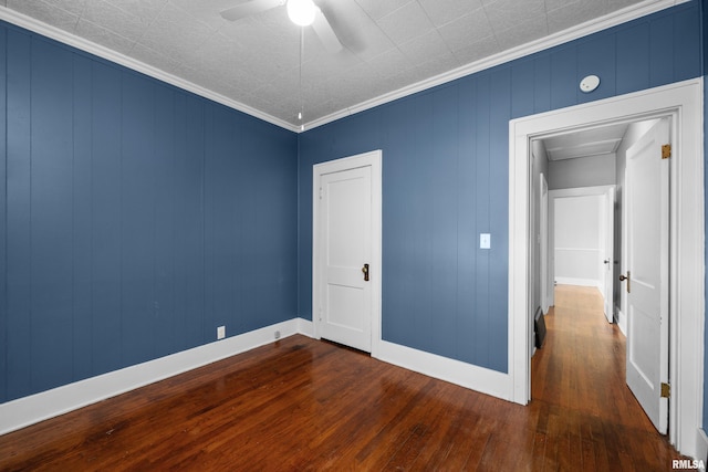 1207 N Marquette St, Davenport, IA 52804 - unfurnished bedroom with dark wood finished floors, ornamental molding, attic access, and a ceiling fan