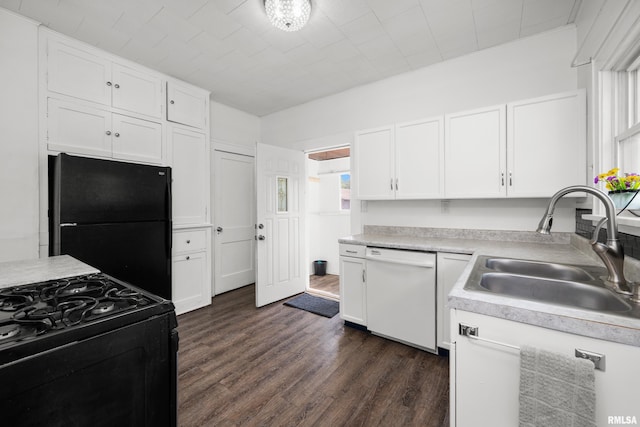 1207 N Marquette St, Davenport, IA 52804 - kitchen with black appliances, dark wood-style floors, white cabinetry, and light countertops