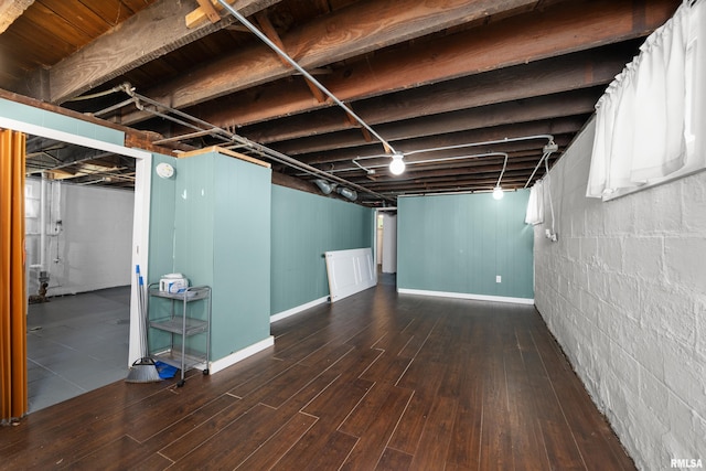 1207 N Marquette St, Davenport, IA 52804 - finished below grade area with wood finished floors and concrete block wall