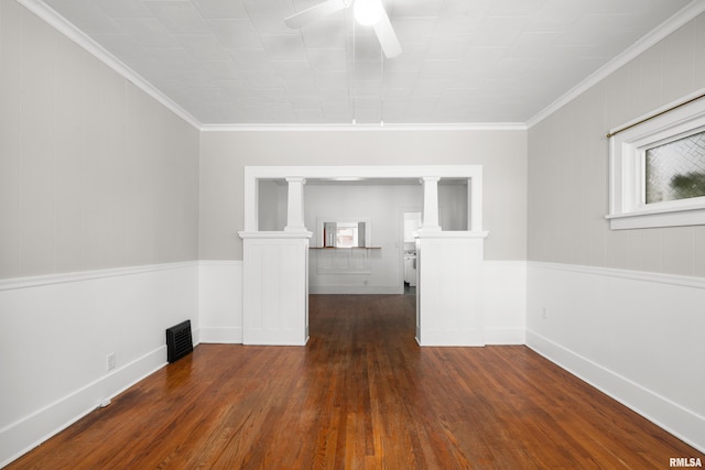 1207 N Marquette St, Davenport, IA 52804 - empty room with a ceiling fan, wood finished floors, ornamental molding, and ornate columns