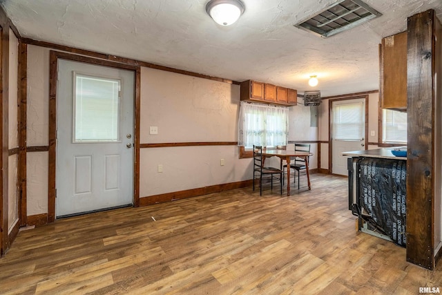 1904 E D St, West Frankfort, IL 62896 - kitchen featuring brown cabinetry and light wood-style flooring