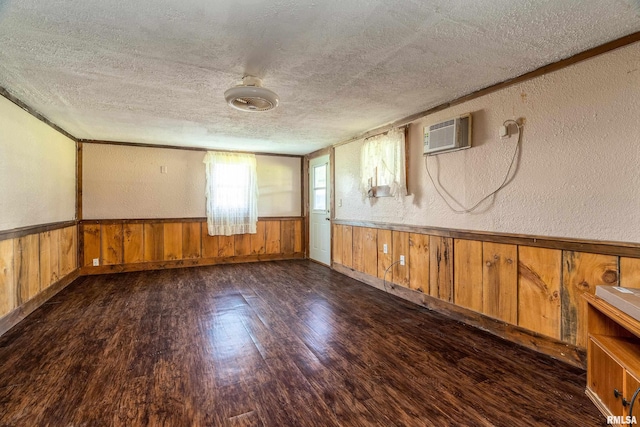 1904 E D St, West Frankfort, IL 62896 - spare room with a textured ceiling, wood finished floors, a textured wall, a wainscoted wall, and wooden walls